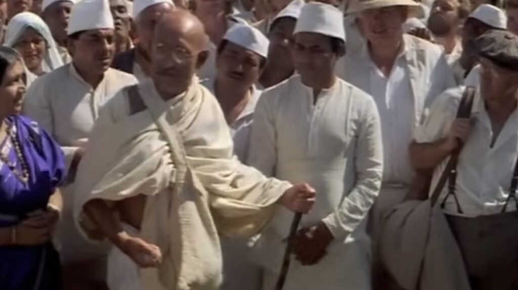 Gandhi, in movie, with handful of salt